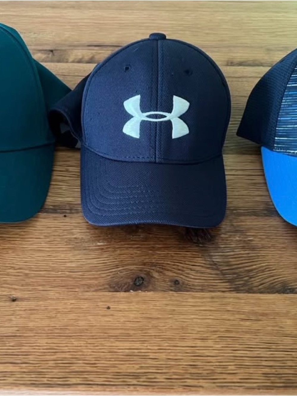 Boys Under Armour and Nike hats